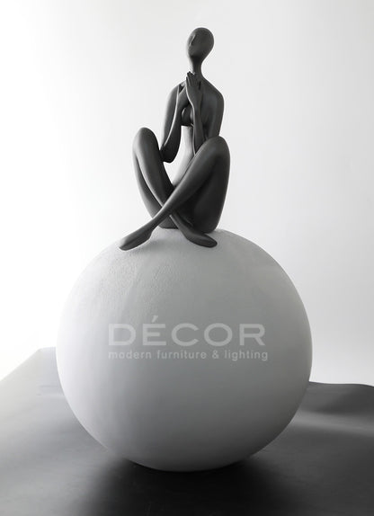 WOMEN ON BALL SCULPTURE