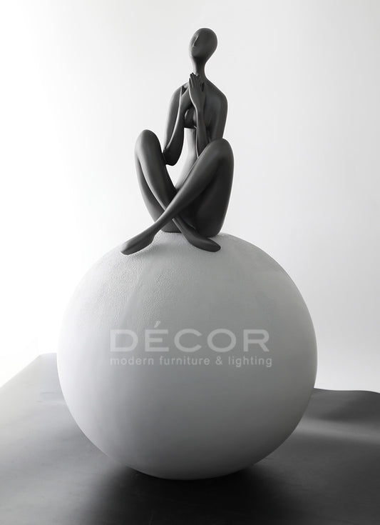 WOMEN ON BALL SCULPTURE