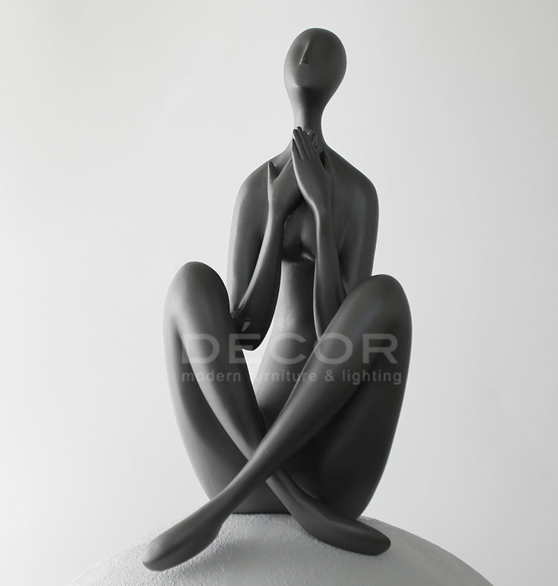 WOMEN ON BALL SCULPTURE